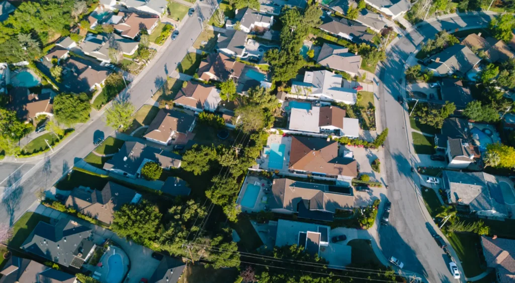 Aerial view of a residential suburb in California. Quality roofing is seen from above. ATTYX Roofing.