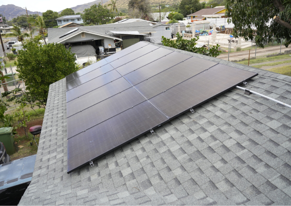 a row of solar panels on a residential roof.